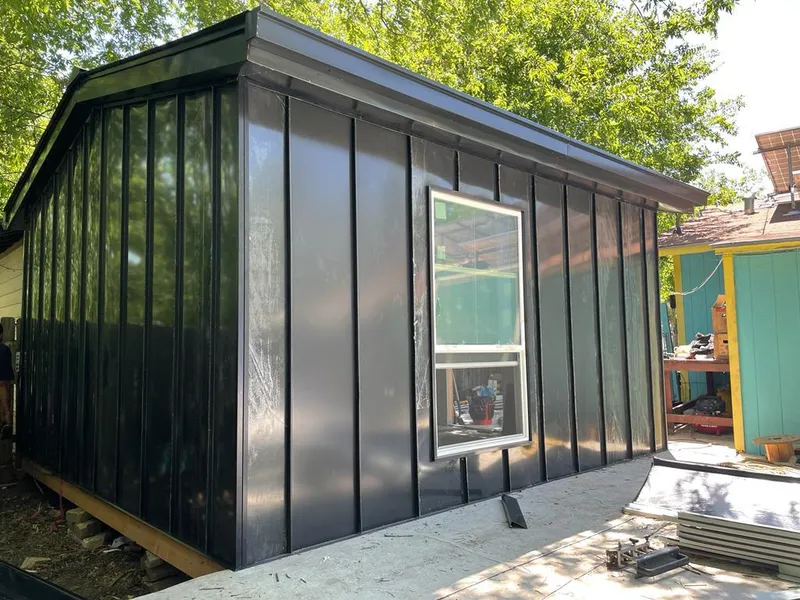 Black standing seam metal wall panels for Roof Inspection in Maynard