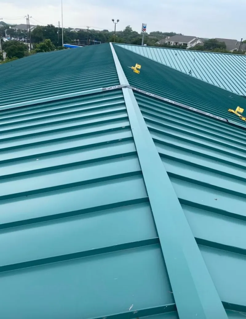 Green commercial metal roof ridge and valley for Metal Roof Repair in Maynard