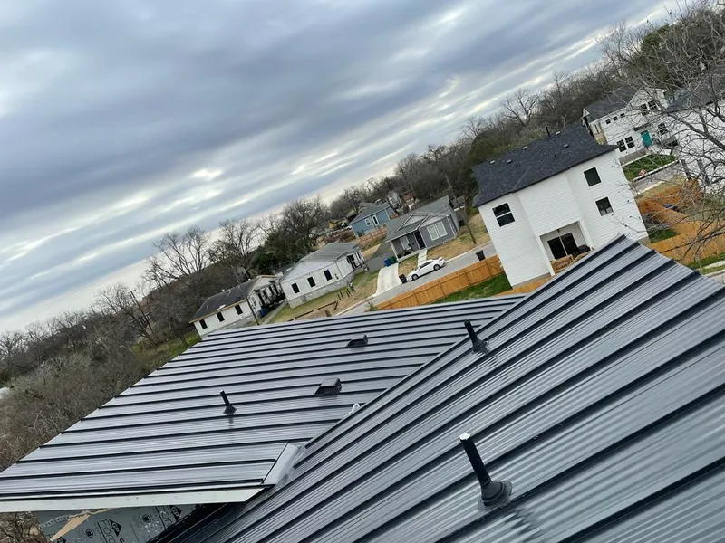 Standing seam metal roof panels with vents for Skylight Repair in Maynard